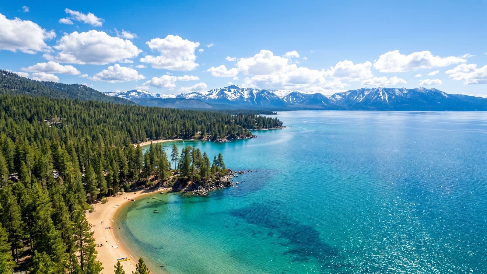 Cave Rock lake-view homes on the Nevada east shore of Lake Tahoe with granite landmark and Sierra backdrop